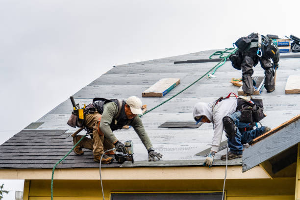 Professional Storm Damage Roof Repair technician working in Laughlintown, PA
